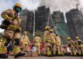 Hong Kong firefighters battle deadly blaze for second day