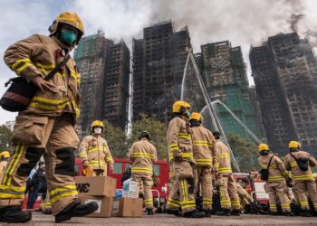 Hong Kong firefighters battle deadly blaze for second day